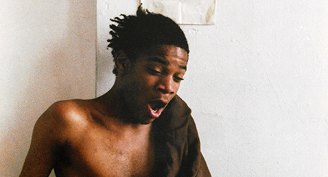 Still image of Jean-Michel Basquiat from the film Boom for Real: The Late Teenage Years of Jean-Michel Basquiat.