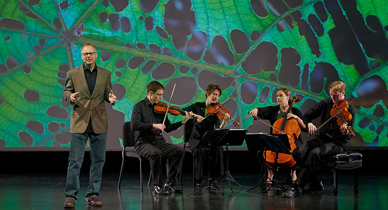 Still image of musicians playing from the program Rising Tide: The Crossroads Project.