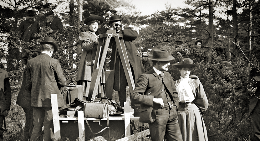 Alice Guy-Blaché stands behind a camera from the film Be Natural: The Untold Story of Alice Guy-Blaché