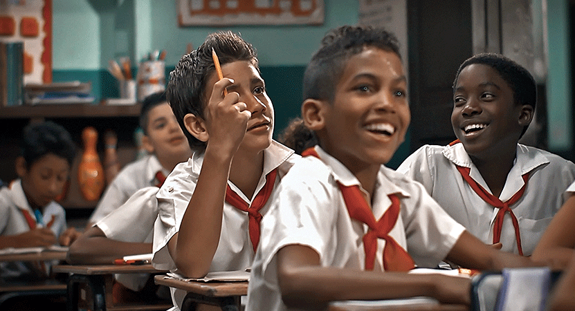 kids sit in a classroom Conducta (Behavior).