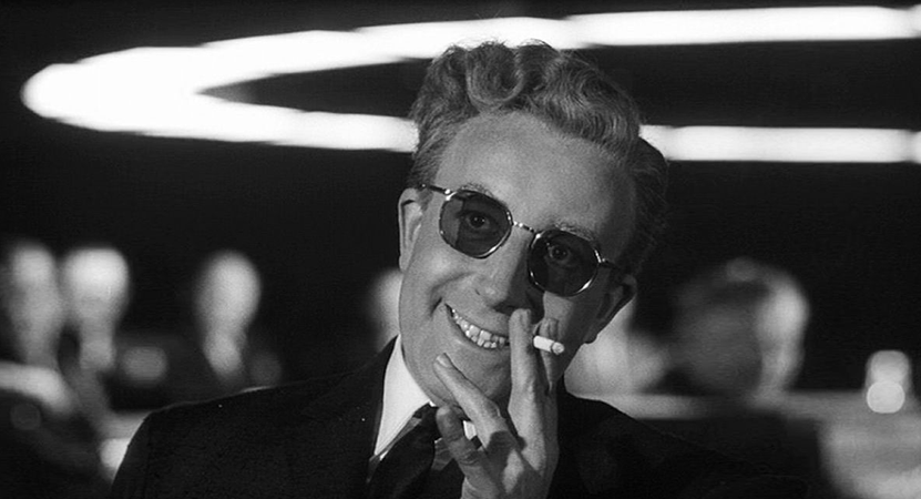 a man smiles holding a cigarette from the film Dr. Strangelove or: How I Learned to Stop Worrying and Love the Bomb