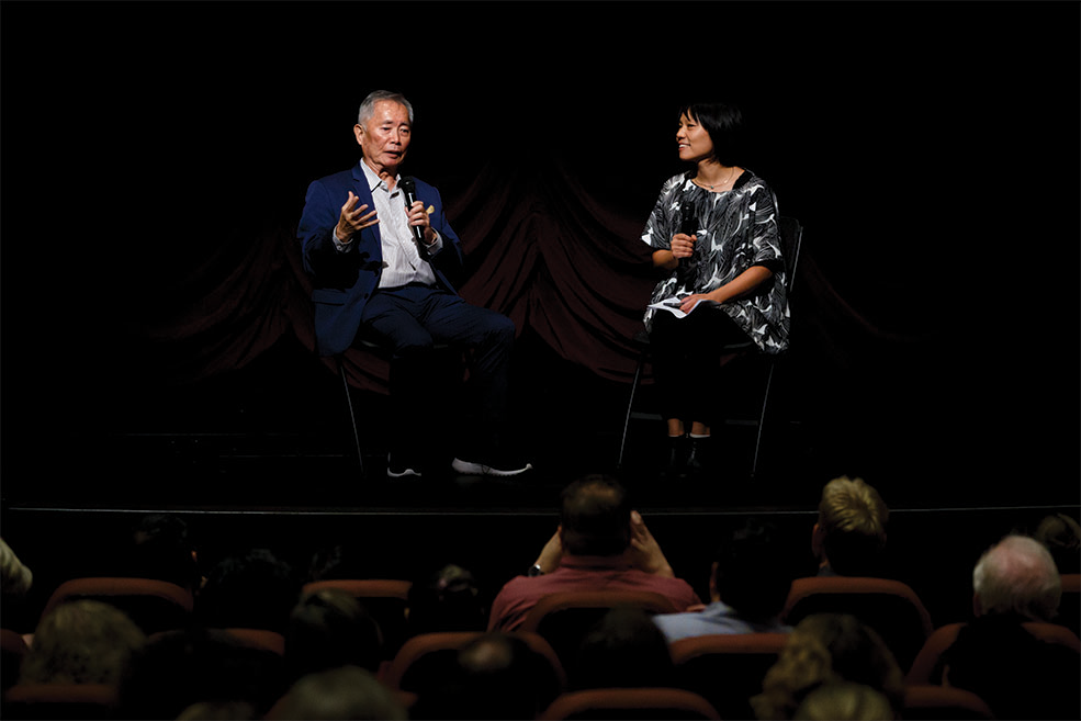 George Takei and Professor Ellen Wu onstage at IU Cinema