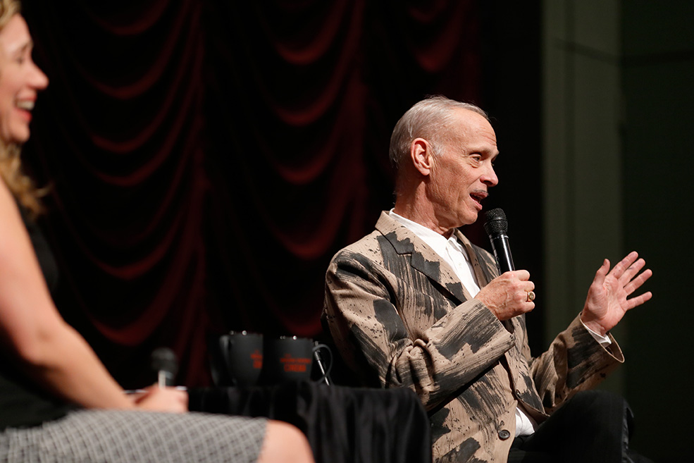 John Waters and Associate Director Brittany D. Friesner onstage at IU Cinema