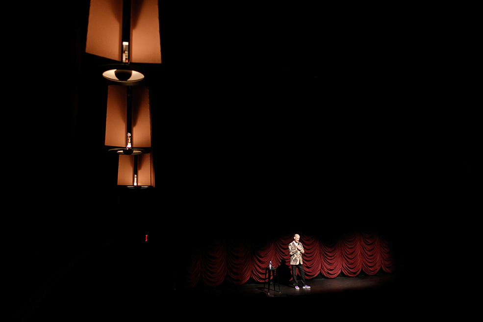 John Waters on stage at IU Cinema performing his one man show.