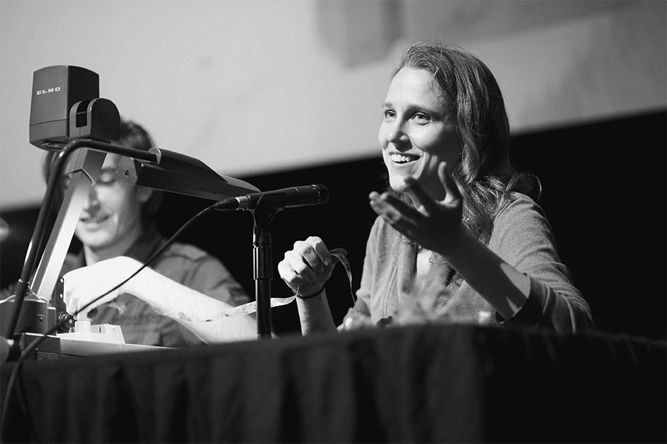 Josephine Decker addresses the audience  while Russell Sheaffer works on film during a Jorgensen Guest Filmmaker event.