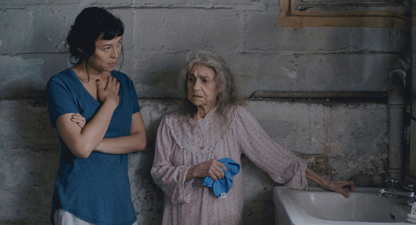 a young women and and old women stand together from the film Lingua Franca