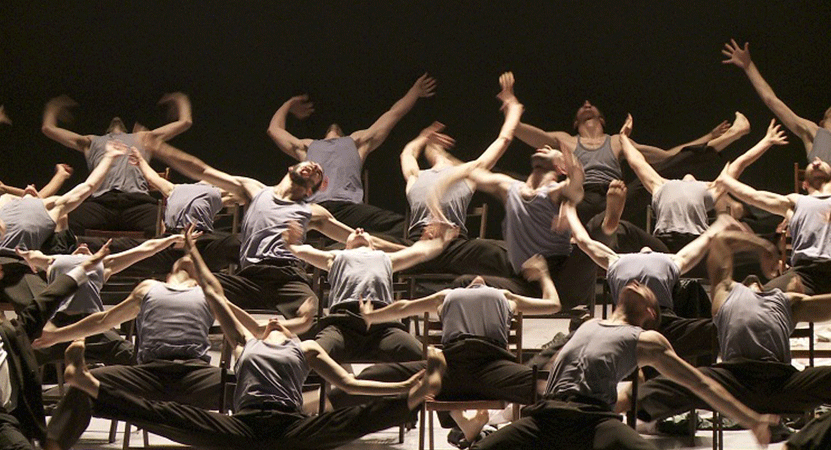 a group dance on stage from the film Mr. Gaga