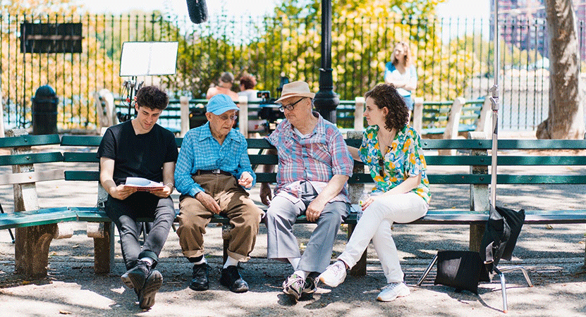 a group of people sit on a bench from the film My Annie Hall