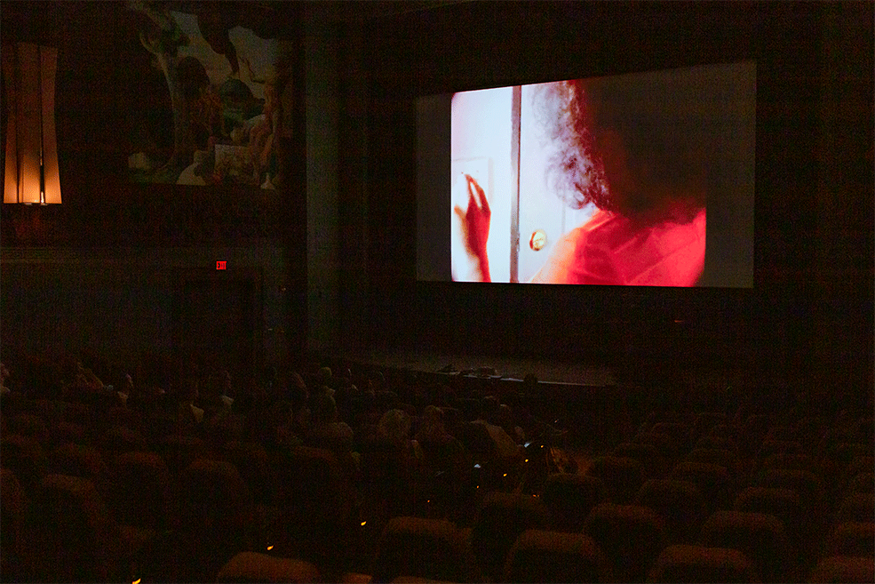 Short Numa Perrier film clip onscreen during a master class at IU Cinema.