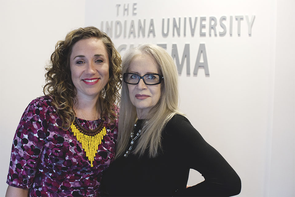 Penelope Spheeris and Associate Director Brittany D. Friesner in the lobby of IU Cinema.