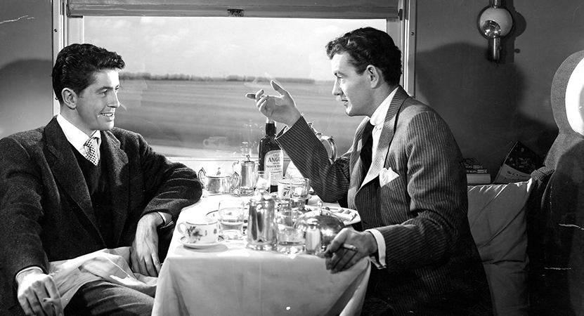 two men share a table from the film Strangers on a Train.