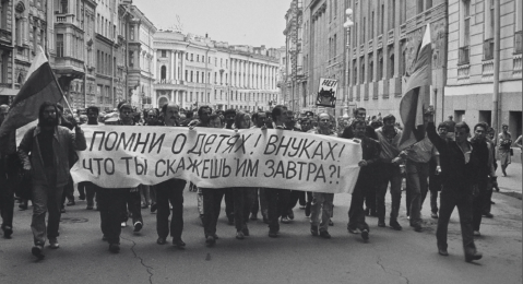 Still image of people marching from the film The Event.