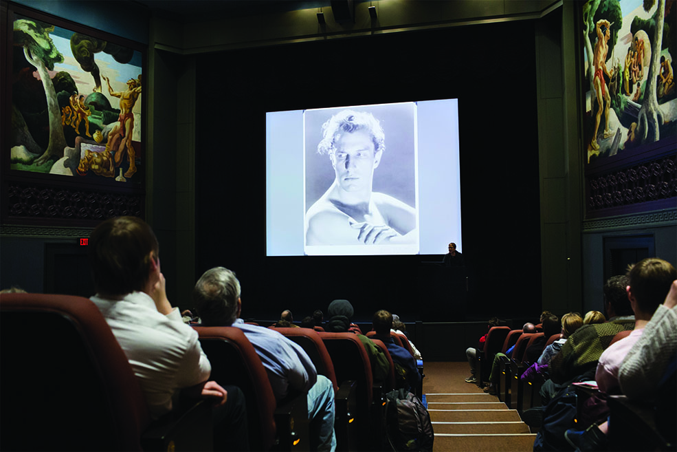 Victoria Price presenting a lecture onstage at IU Cinema.